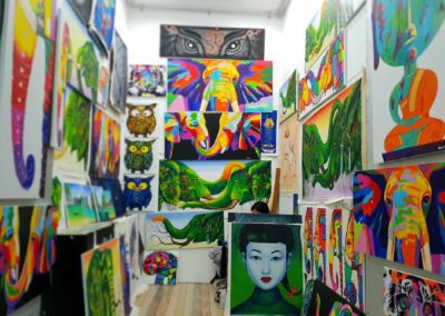 Colourful art depicting Elephants and other animals local to Thailand for sale at Naka Night Market, Phuket