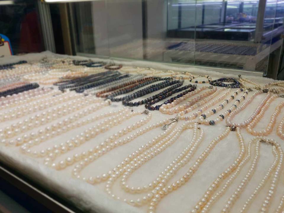 Pearl necklaces for sale at Naka Weekend Market
