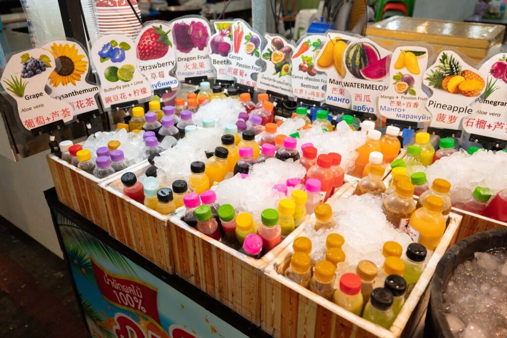 Refreshing bottles of fresh fruit juice available at Naka Weekend Market