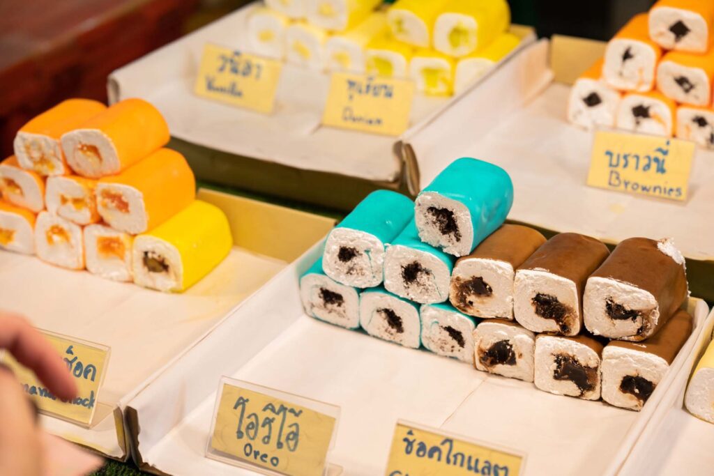 Colourful cakes and desserts for sale at Naka Weekend Market