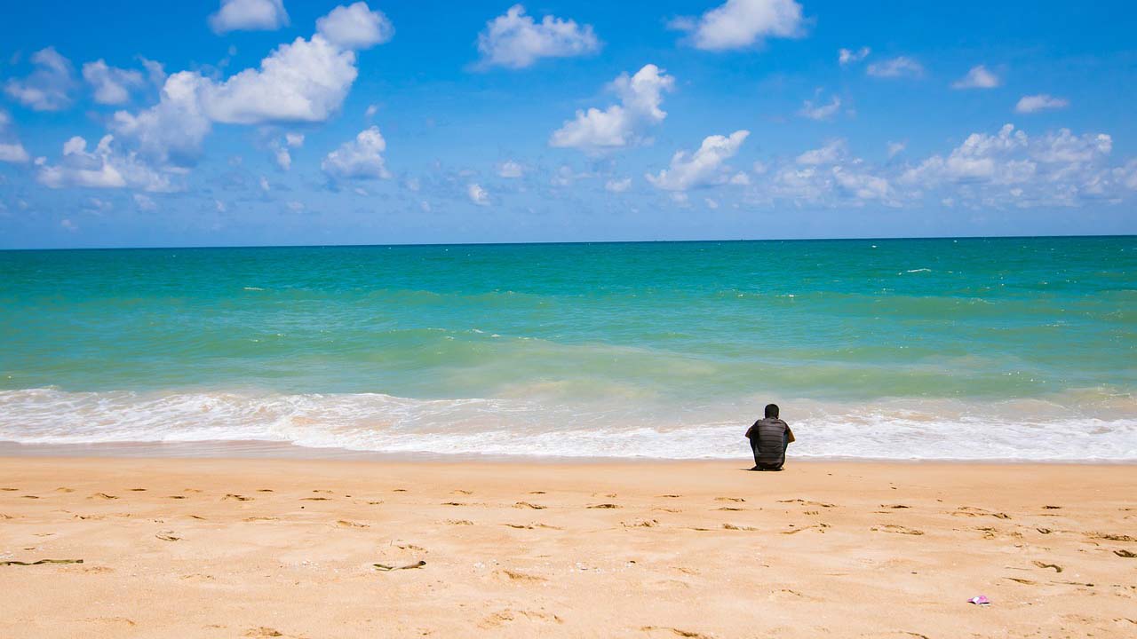 Spend the morning at the beach before visiting Naka Night Market in the evening